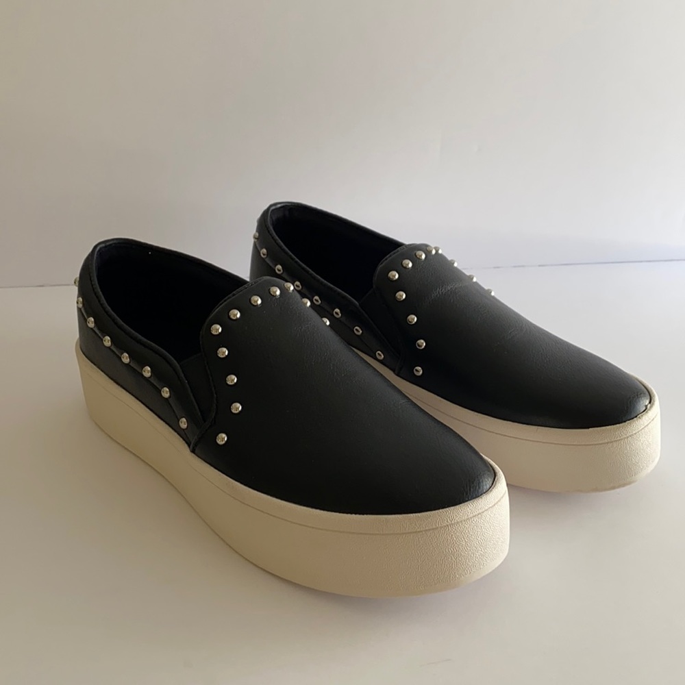 Black slip-ons with studs